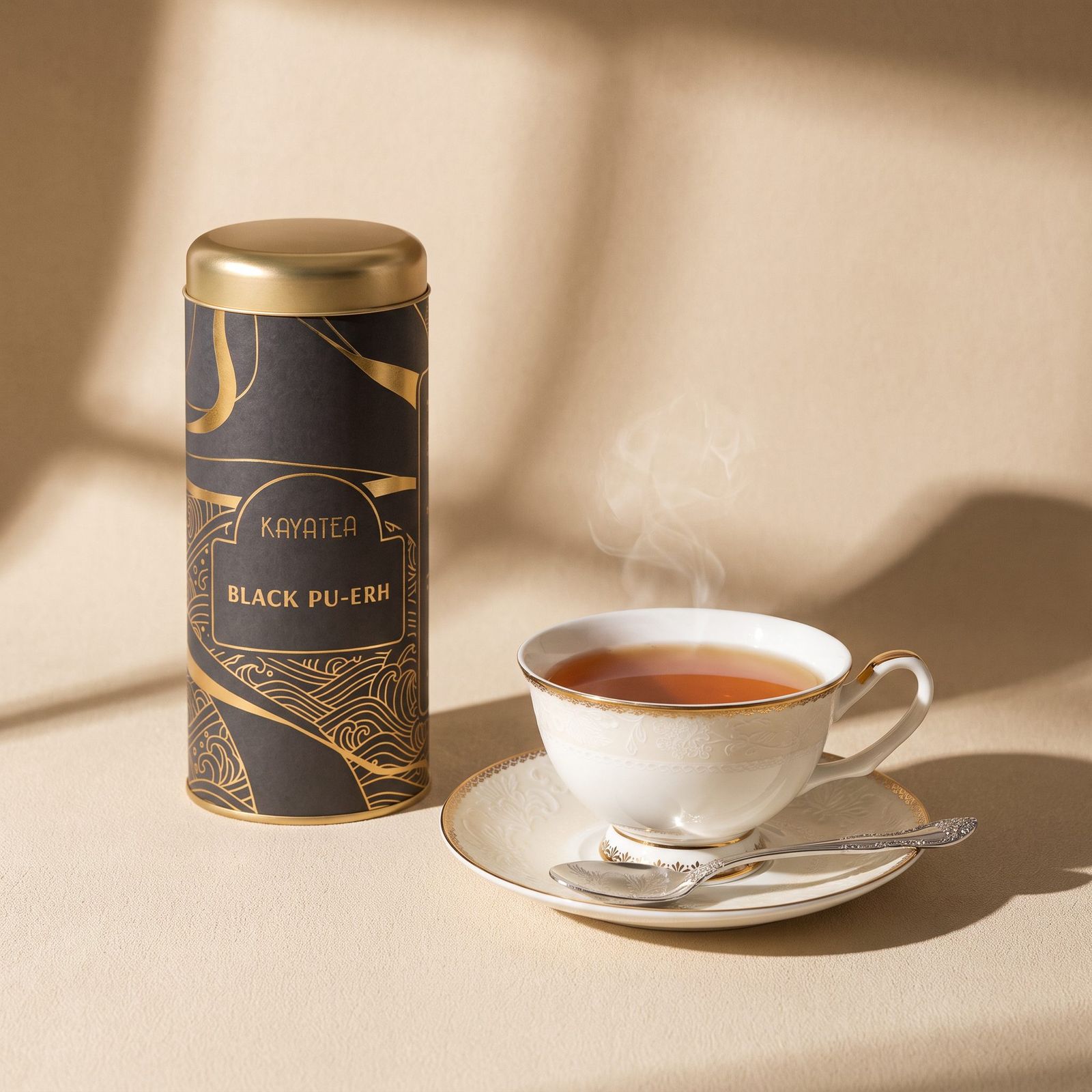 A Kayatea Black Pu-Erh tin beside a cup of tea in morning light